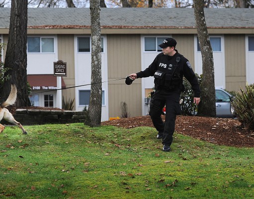 Suspect in Washington police shootings wounded, still at large