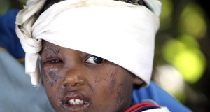 International earthquake relief begins arriving in a devastated Haiti