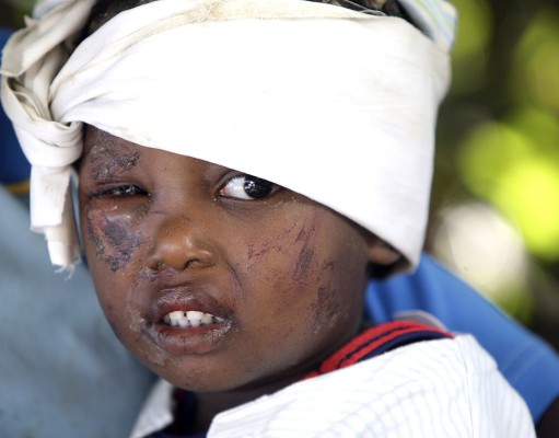 International earthquake relief begins arriving in a devastated Haiti