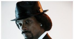 Snoop Dogg takes his pimp strut to the executive office