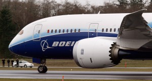 Boeing says health care charge slashes profit