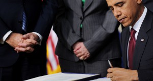 Obama signs debt measure, urges focus on jobs