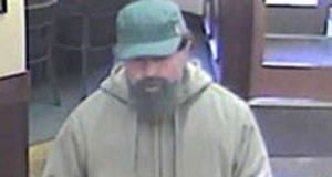 Suspect at large after bank robbery