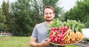 Cottage foods 2.0 farmer Mark Guttridge with basket of carrots and radishes
