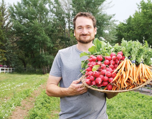 Cottage foods 2.0 farmer Mark Guttridge with basket of carrots and radishes