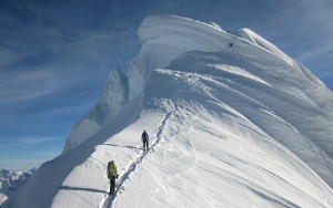 ACSP director John All and volunteer Kate Von Krusenstiern climb the final push to the 20,846 foot summit of Chopicalqui in the Cordillera Blanca.