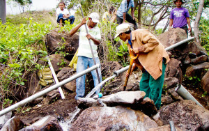 Several villagers in Nicaragua work to connect the pipeline that will bring safe drinking water to their community.