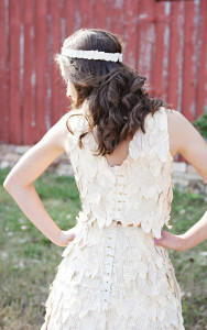 Nicoline West models her dress made of book pages, dyed with tea.