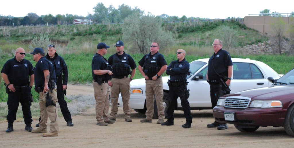 Shortly after protesters pushed passed the three officers originally positioned at the well site, a total of 15 officers in unmarked cars arrived. 