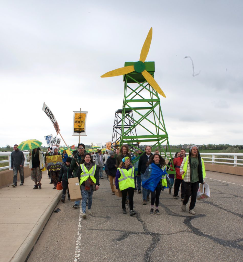 Protesters left their unpermitted location on open space around 3 p.m. and marched in unison to the dirt road leading to the well site near Silver Creek Elementary School. 