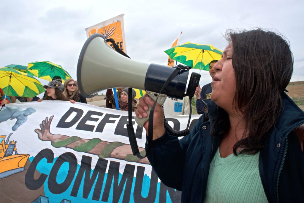 At the staging area at the top of the dirt road leading to the well site, protesters were told that only those willing to risk arrest should continue on to the well. Approximately 40 people then continued the march to the well. 