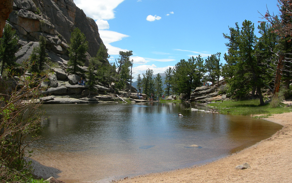 Hike up erosion sculpted sandstone and granite rocks to Gem Lake.