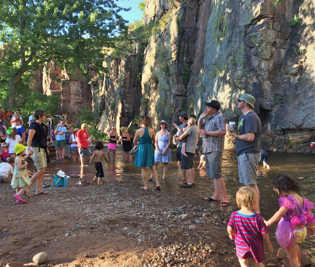 Families and friends chillin' by the River at the Rocky Mountain Folks Festival in Lyons, Colorado.