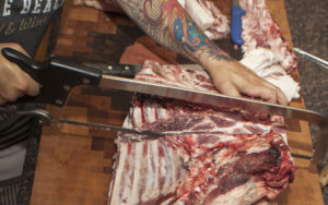 Master butcher Jason Nauert demonstrates how to break down a pig into standard cuts.