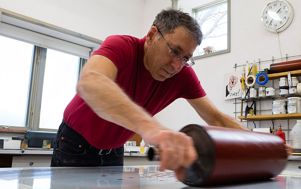 Master printer Bud Shark working in his studio.