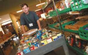 Russell Hallesy volunteers for Sister Carmen Food Bank.