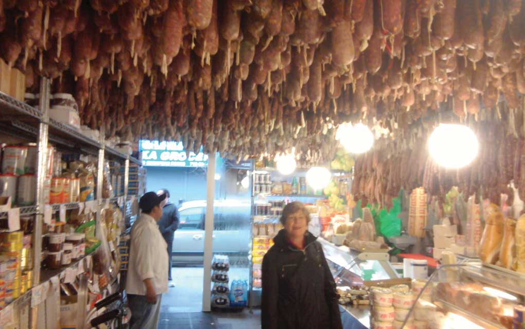 A world of salumi hangs from the ceiling at Calabria Pork Store on Arthur Avenue in New York. 