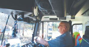 Cleaning the stream Steve Klemish driving a composting truck in Longmont