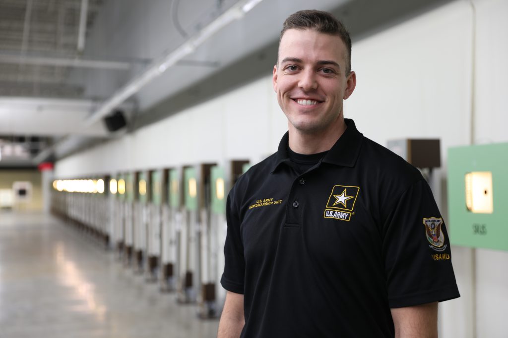 Tim Sherry poses for a photo at a rifle event